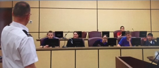 Then-LTC Hayes instructing local junior high-school students, and perhaps future judge advocates, before presiding over their mock trial in Fort Bliss, TX, circa 2014. (Photo courtesy of author)